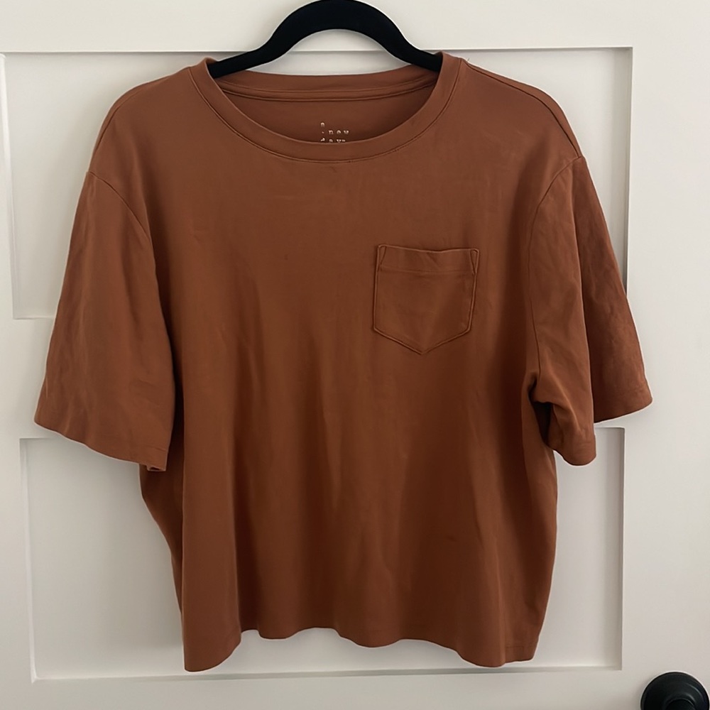 A new day burnt orange t shit, size large